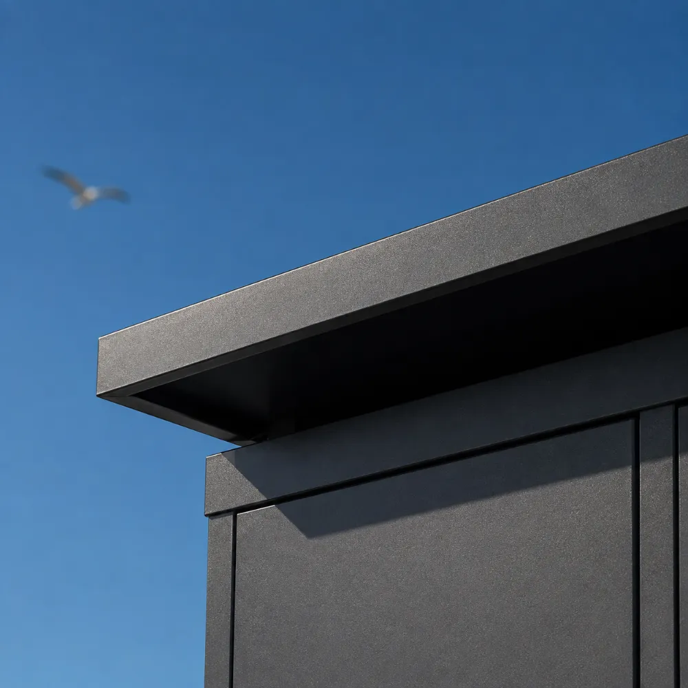 Concept visualization macro: the flat roof overhang edge against a blue sky, a gull out of focus behind